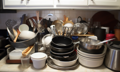 Image description: A neatly arranged set of kitchen cabinets with labeled shelves for specific items such as plates, cups, spices, and pots and pans.