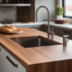 A photo of a kitchen counter with various tools and utensils on it, and a person standing nearby looking frustrated. The alt text could read: "A cluttered kitchen counter with limited space, causing frustration for the person trying to prepare food. Tips are discussed for maximizing counter space."